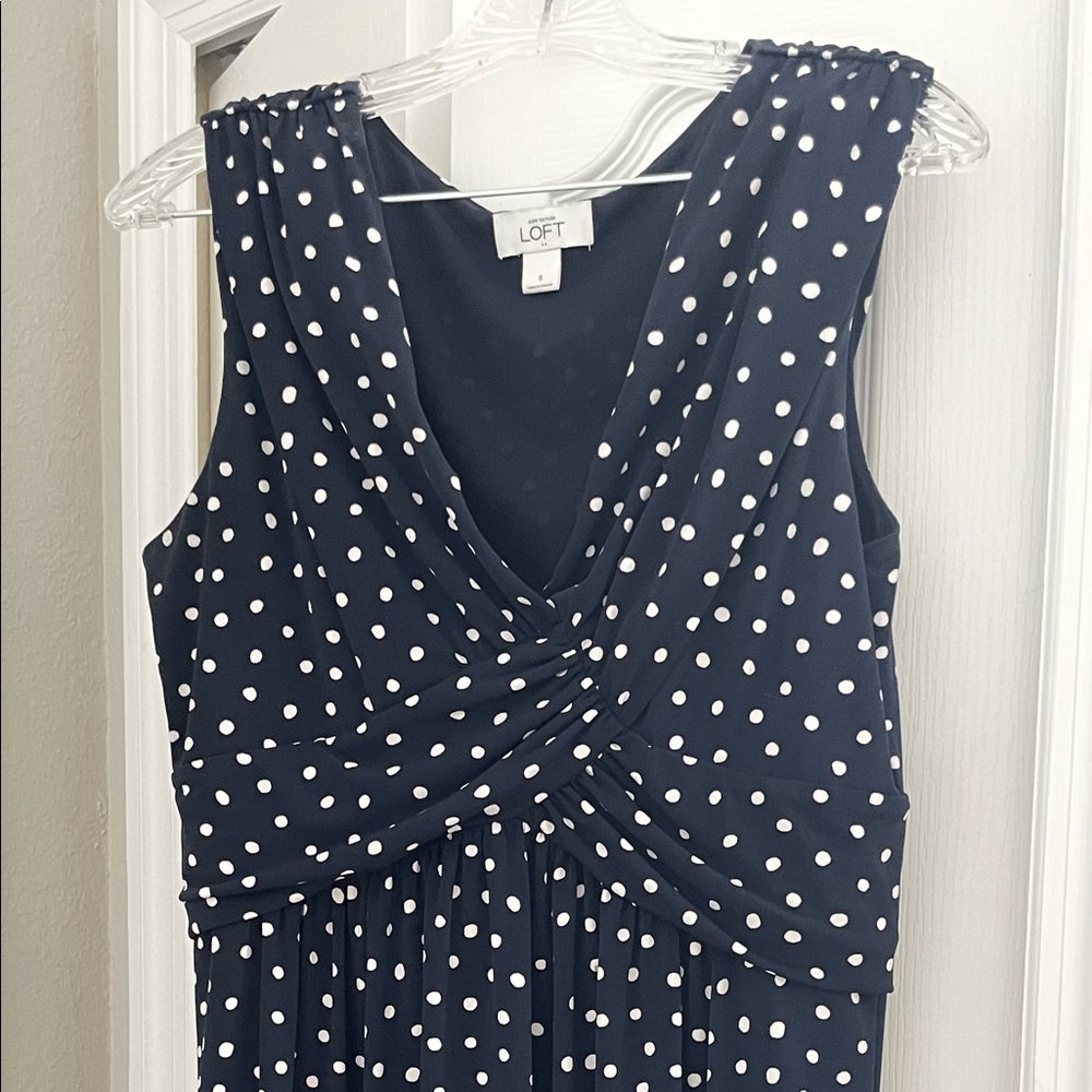 Ann Taylor Loft sleeveless navy blue and white polka dot dress.